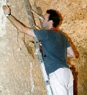 Stephen Rickerby examining plaster in tomb 121 (click to open)
